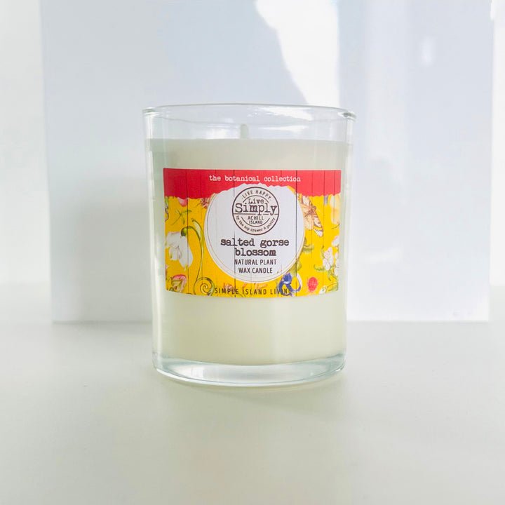 Candle with a colorful label on a white background