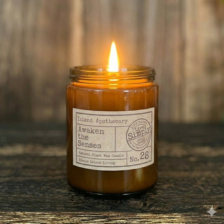 Awaken the Senses (No. 28) hand-curated apothecary candle in a signature amber glass jar by Live Simply Apothecary, inspired by the vitality of Keel Beach.